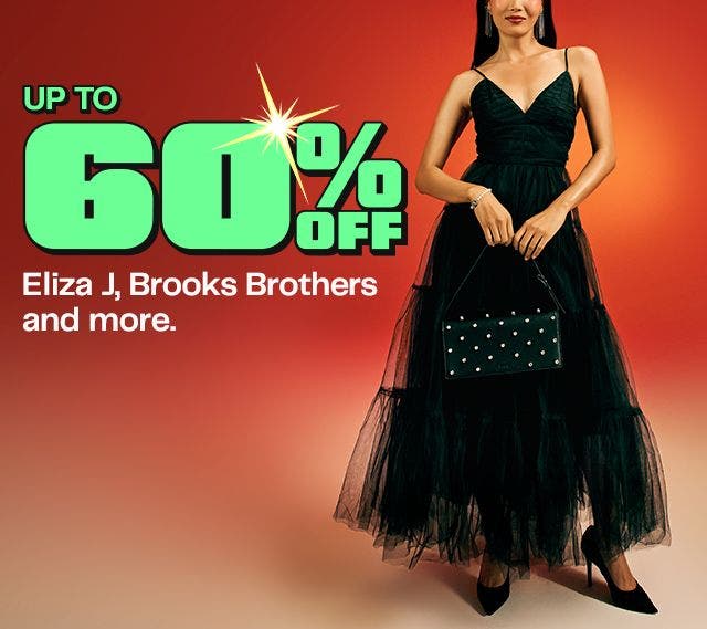 A woman in a black sleeveless tulle gown holding a black studded handbag against a red-orange gradient background