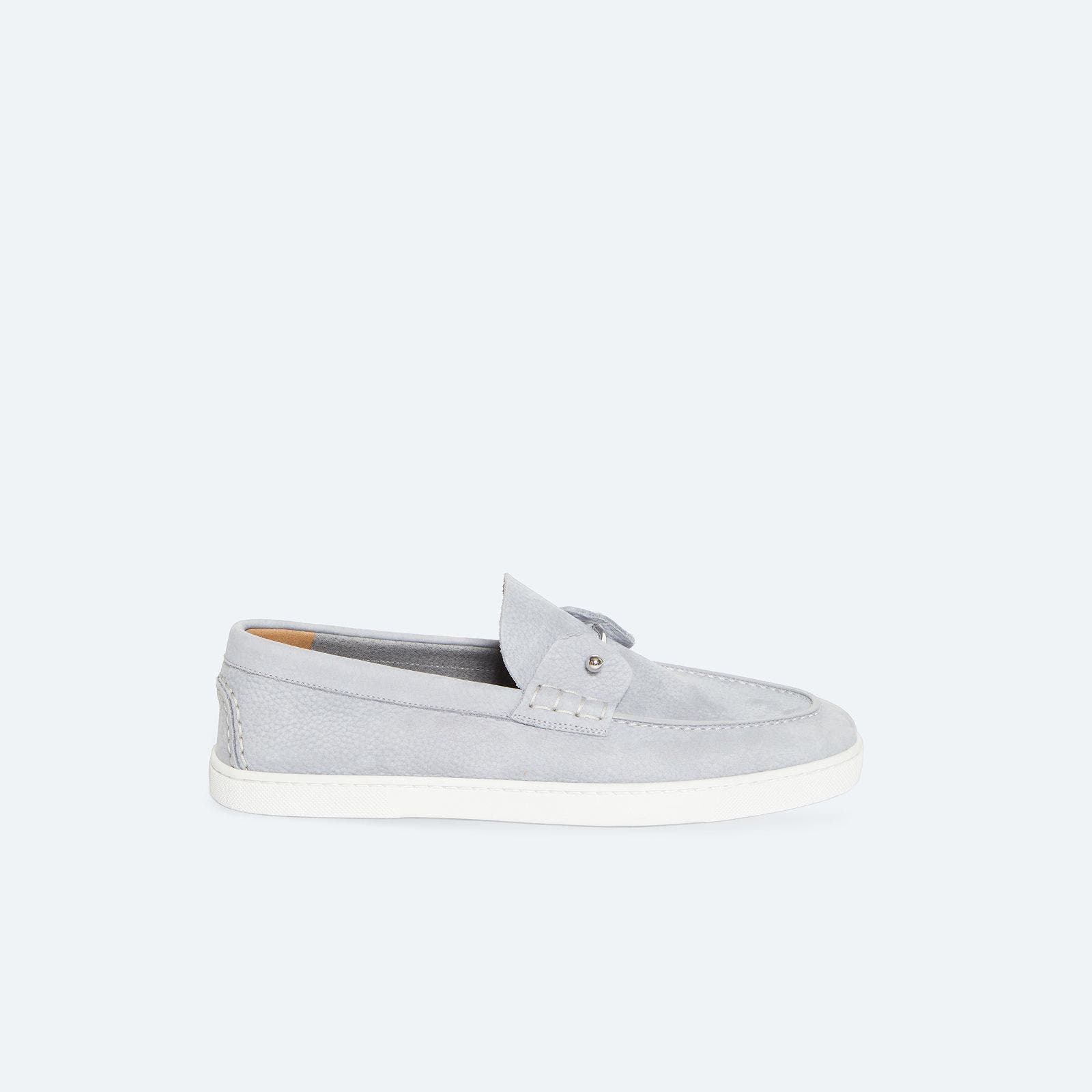 A grey leather loafer with silver barbell hardware.