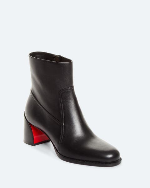 Black leather ankle boot with a round toe, side zip closure, and a red block heel.