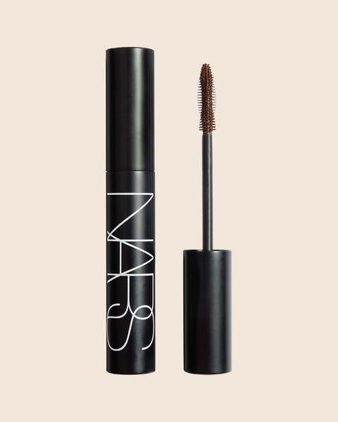 An open NARS mascara with a black cap and a brown bristled wand.