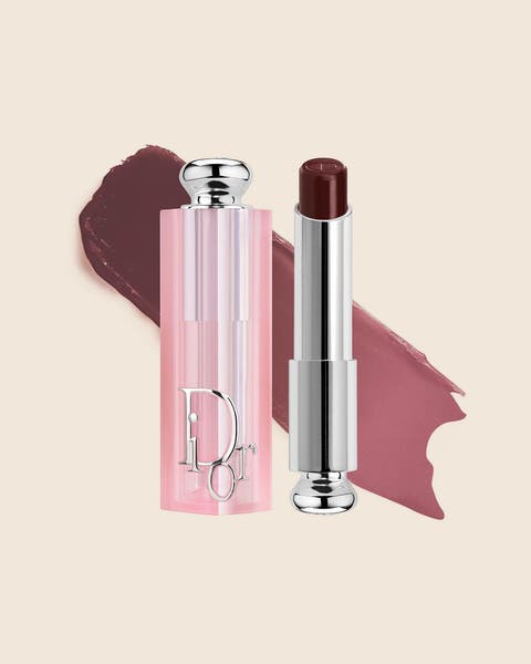 A pink DIOR lip balm with a deep berry bullet and a matching swatch.