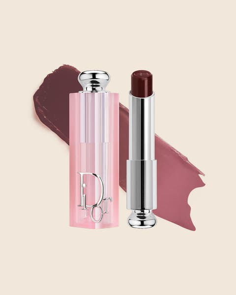 A pink DIOR lip balm with a deep berry bullet and a matching swatch.