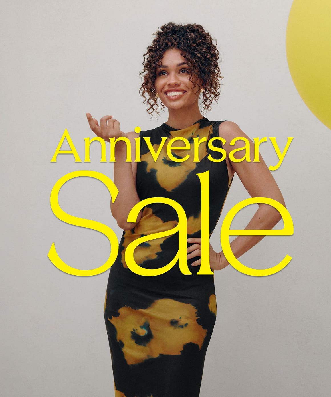 Anniversary Sale: a woman in a printed dress.