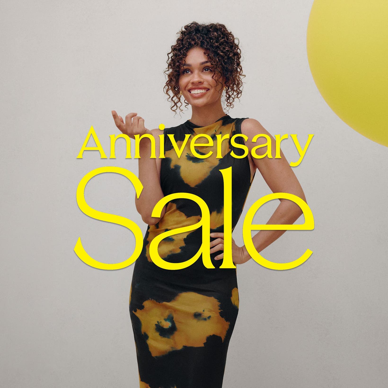 Anniversary Sale: a woman in a printed dress.
