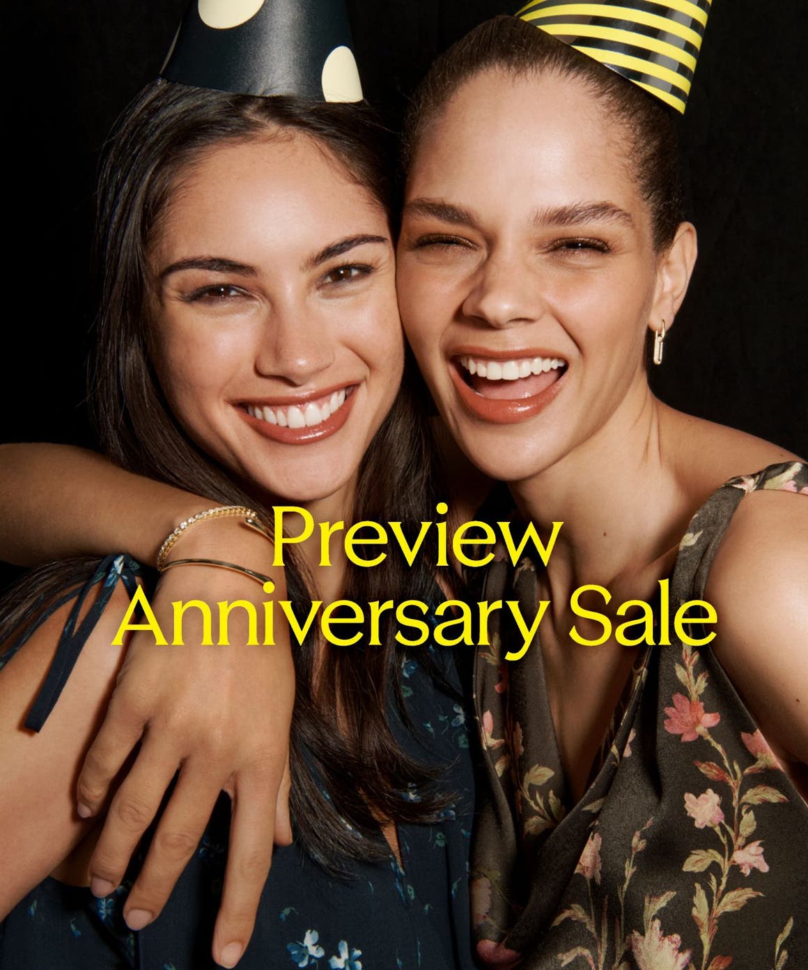 Preview Anniversary Sale: two laughing women in party hats.