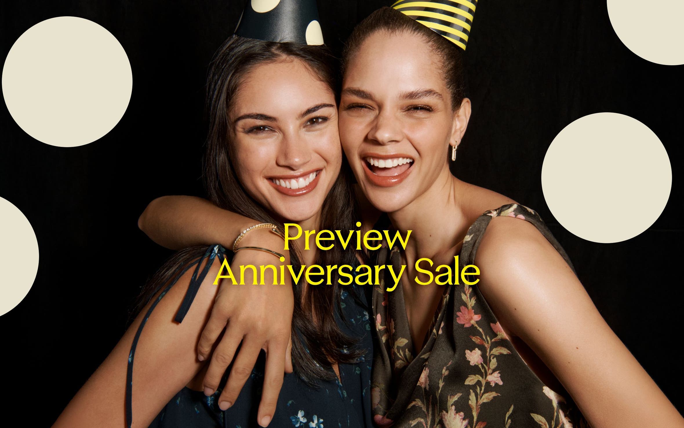 Preview Anniversary Sale: two laughing women in party hats.