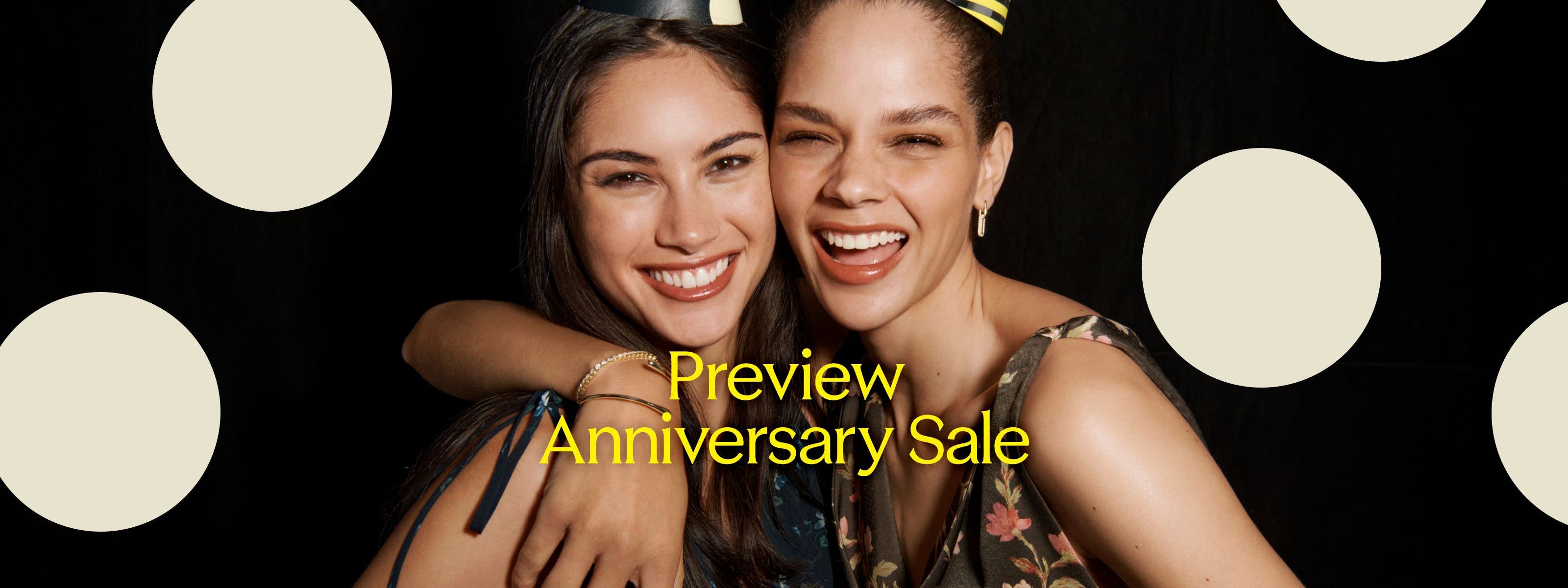 Preview Anniversary Sale: two laughing women in party hats.