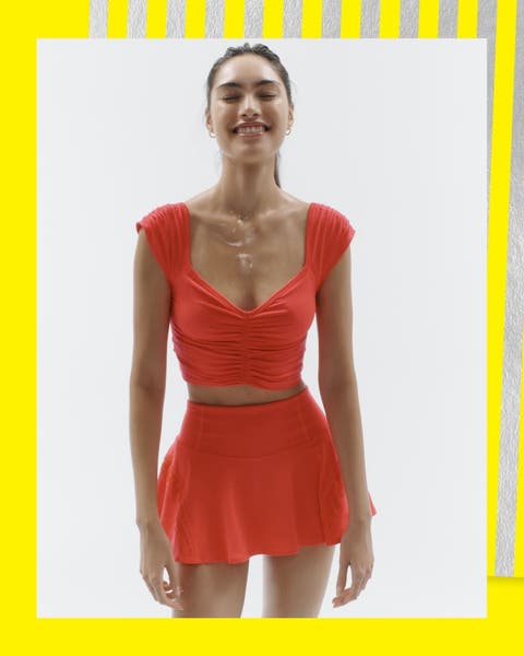 A woman wearing an active skirt and matching top.