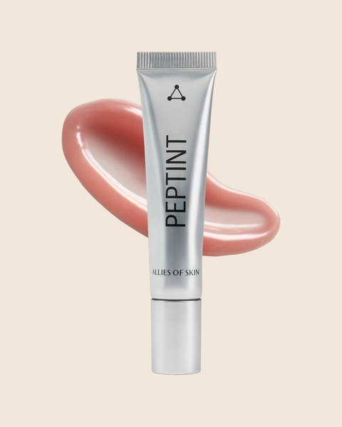 An ALLIES OF SKIN Peptint lip treatment in a silver tube with a rosy pink swatch.