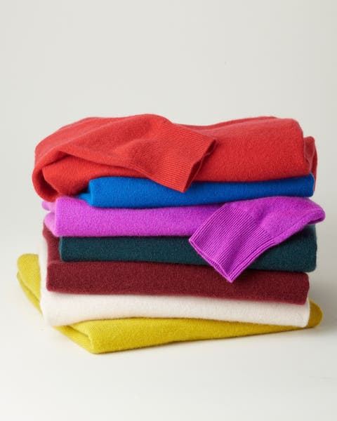 A colorful stack of sweaters.