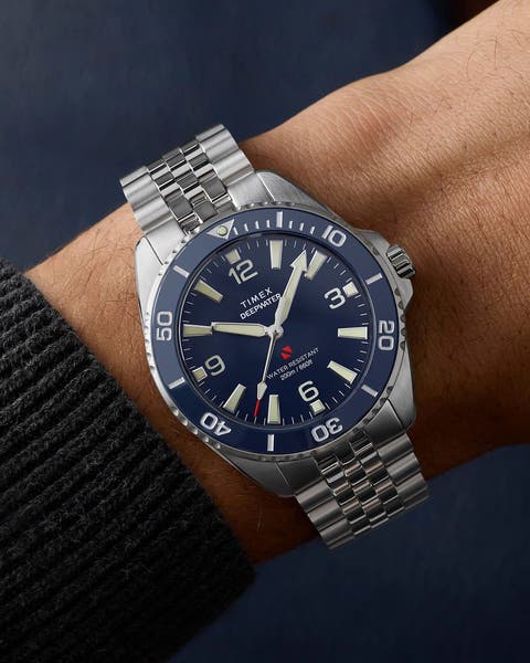 Silver watch on a man's wrist.
