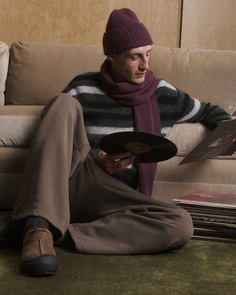 A man looking at records.