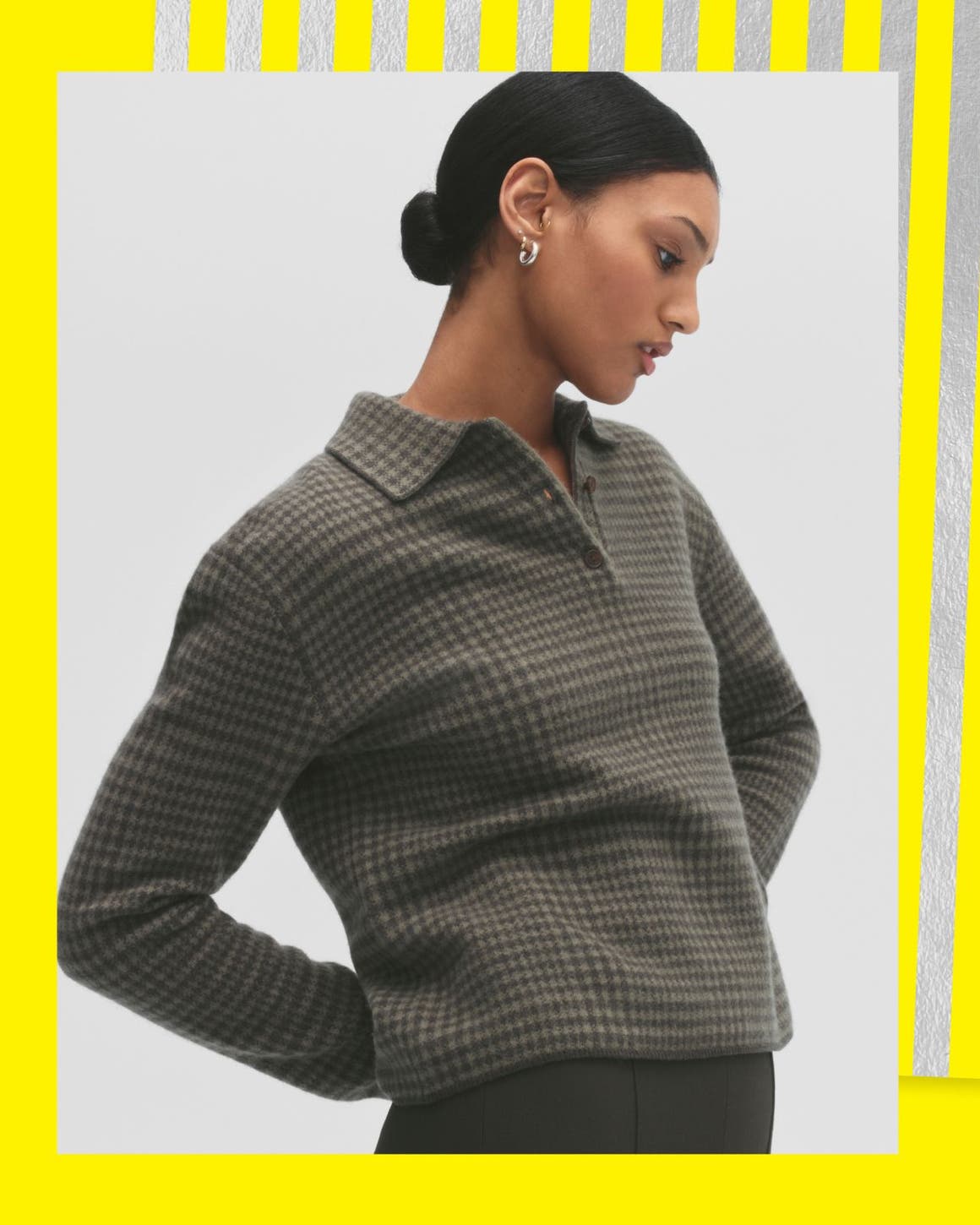 A woman wearing a plaid sweater.