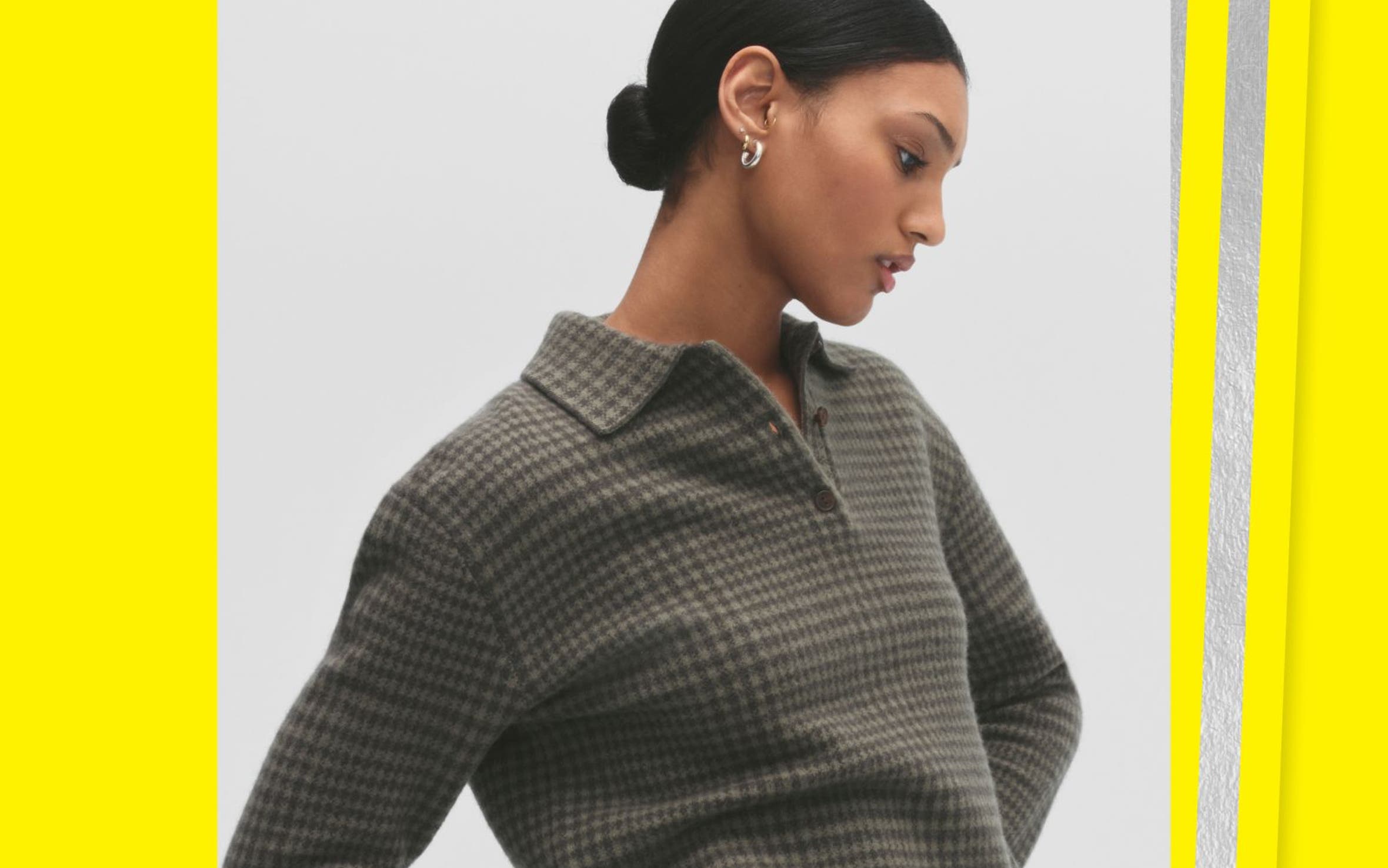 A woman wearing a plaid sweater.
