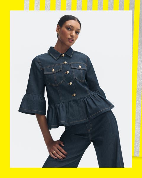 A woman wearing a denim top and jeans.