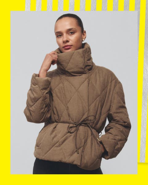 A woman wearing a funnel-neck coat.