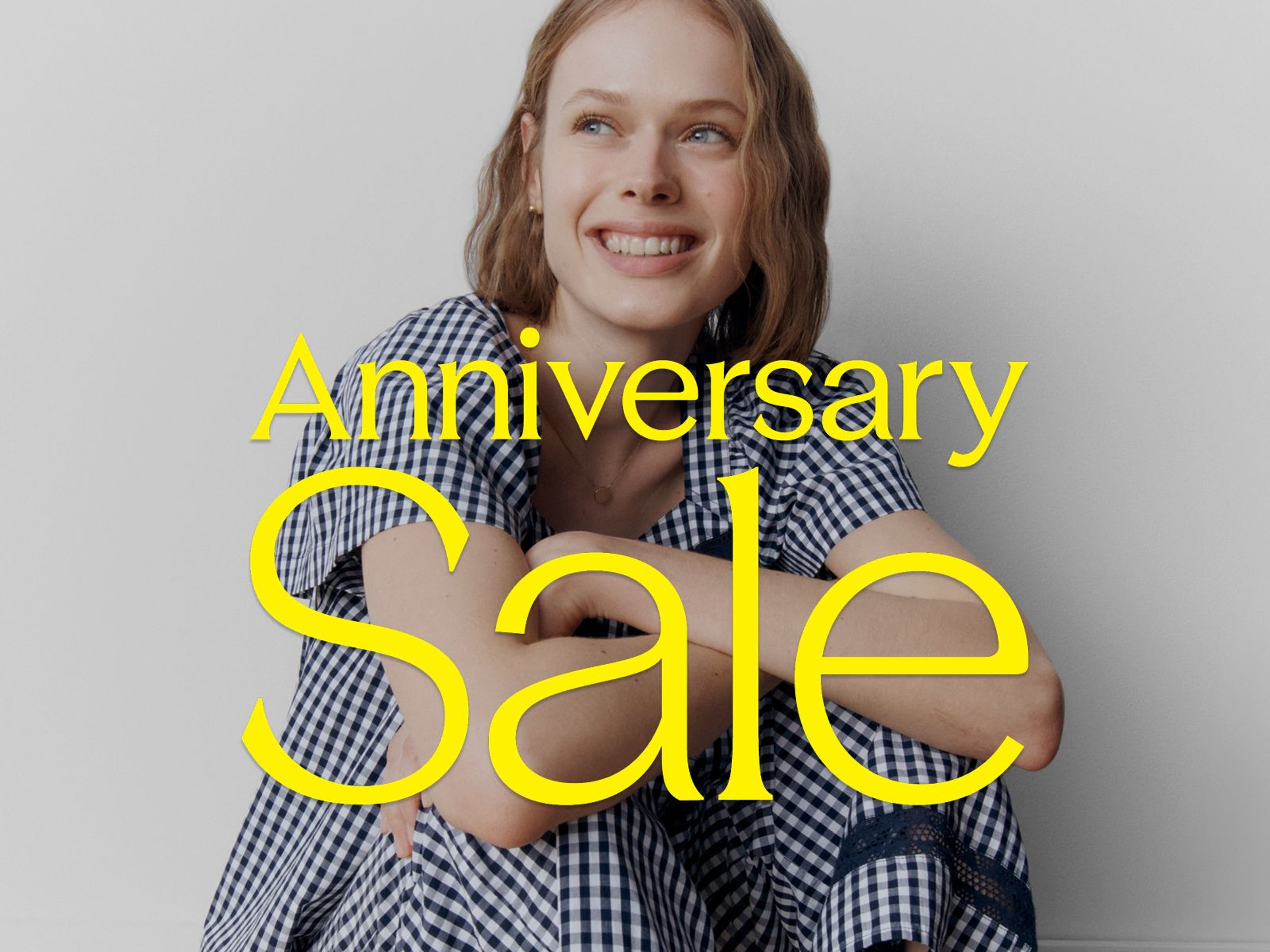Anniversary Sale: a woman in a blue and white gingham PJ set.