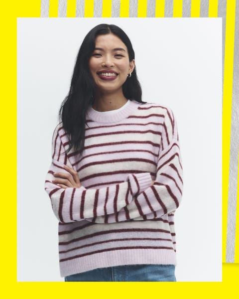 A woman wearing a striped long sleeve shirt.