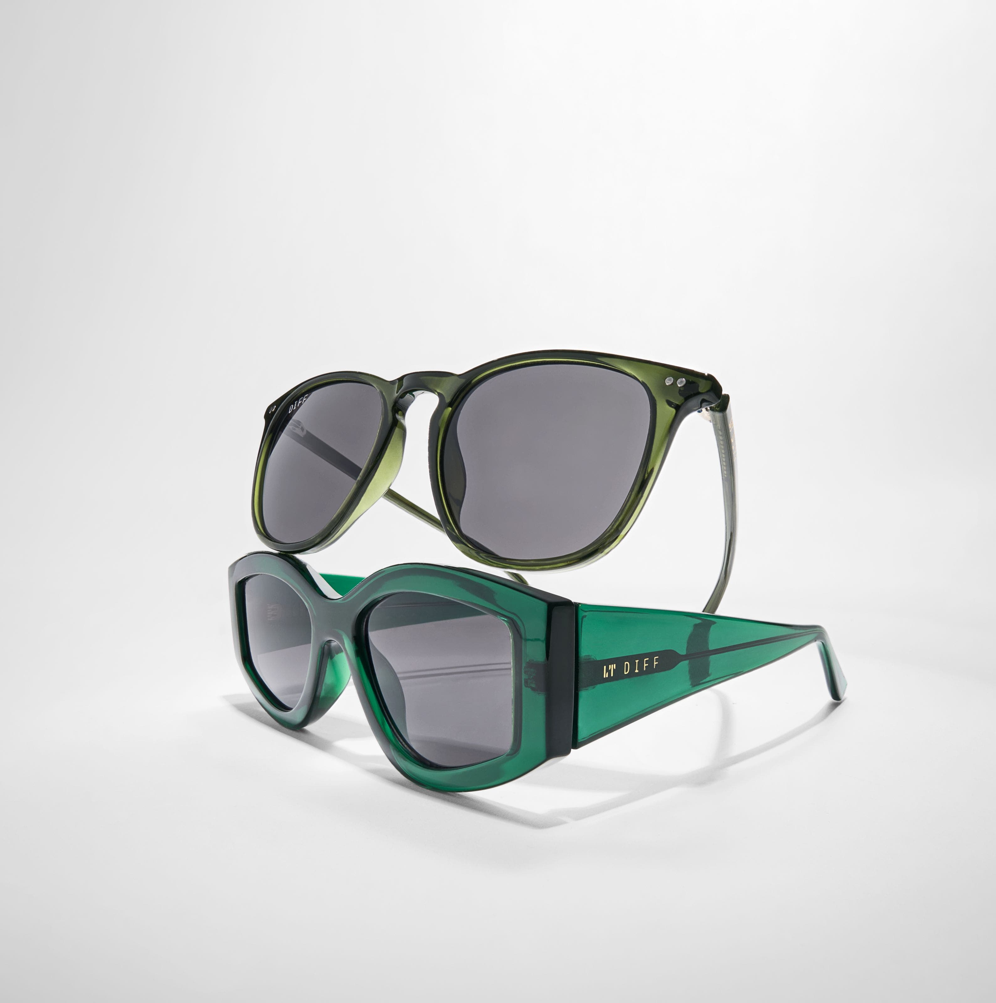 Two pairs of green translucent sunglasses. 