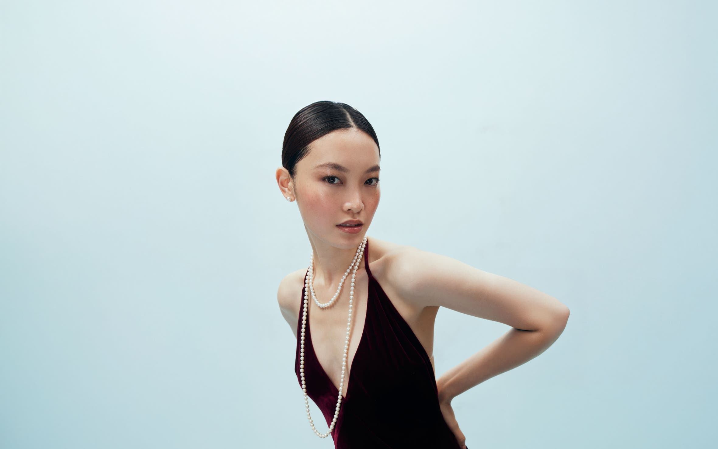 Woman wearing pearls. 