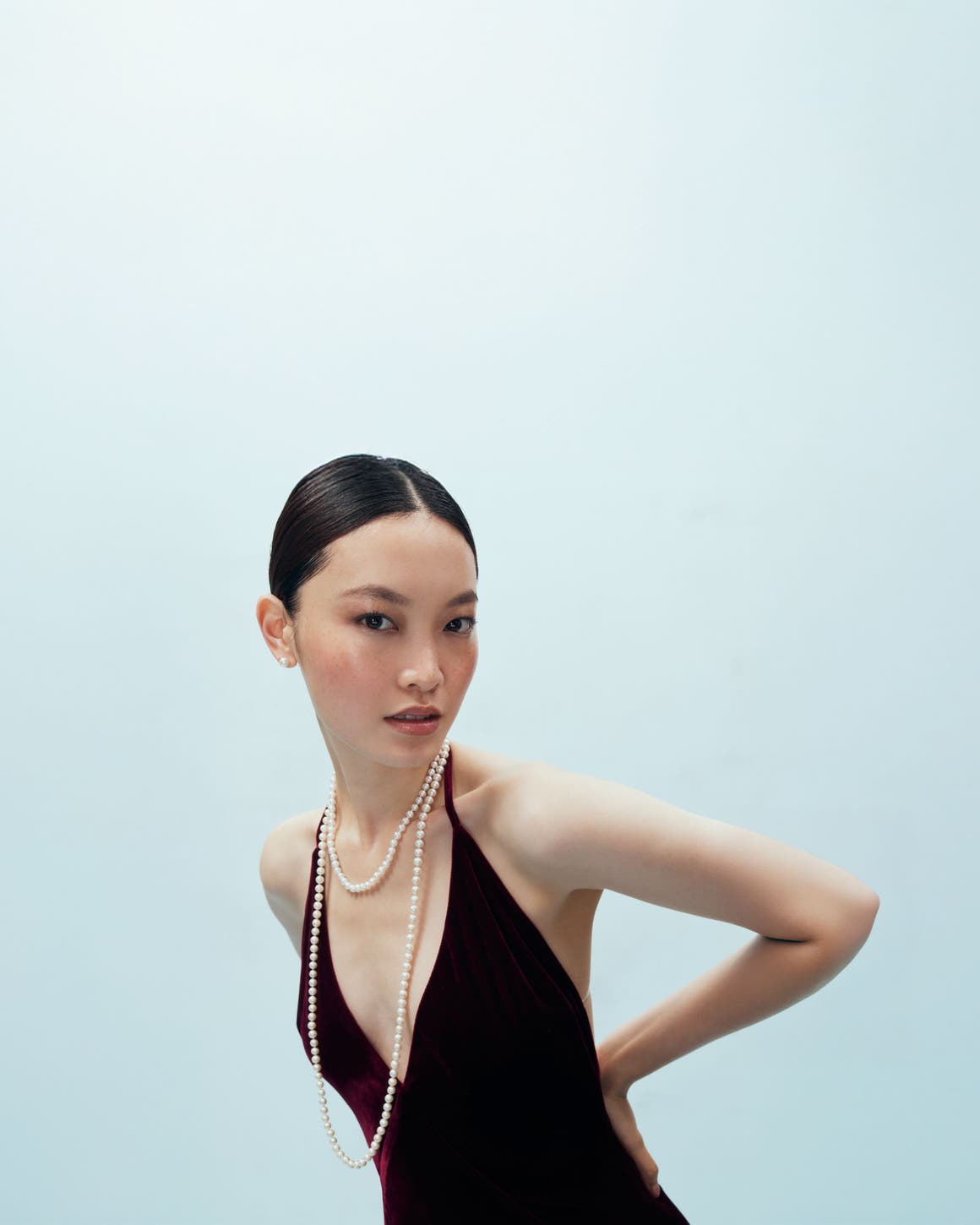 Woman wearing pearls. 