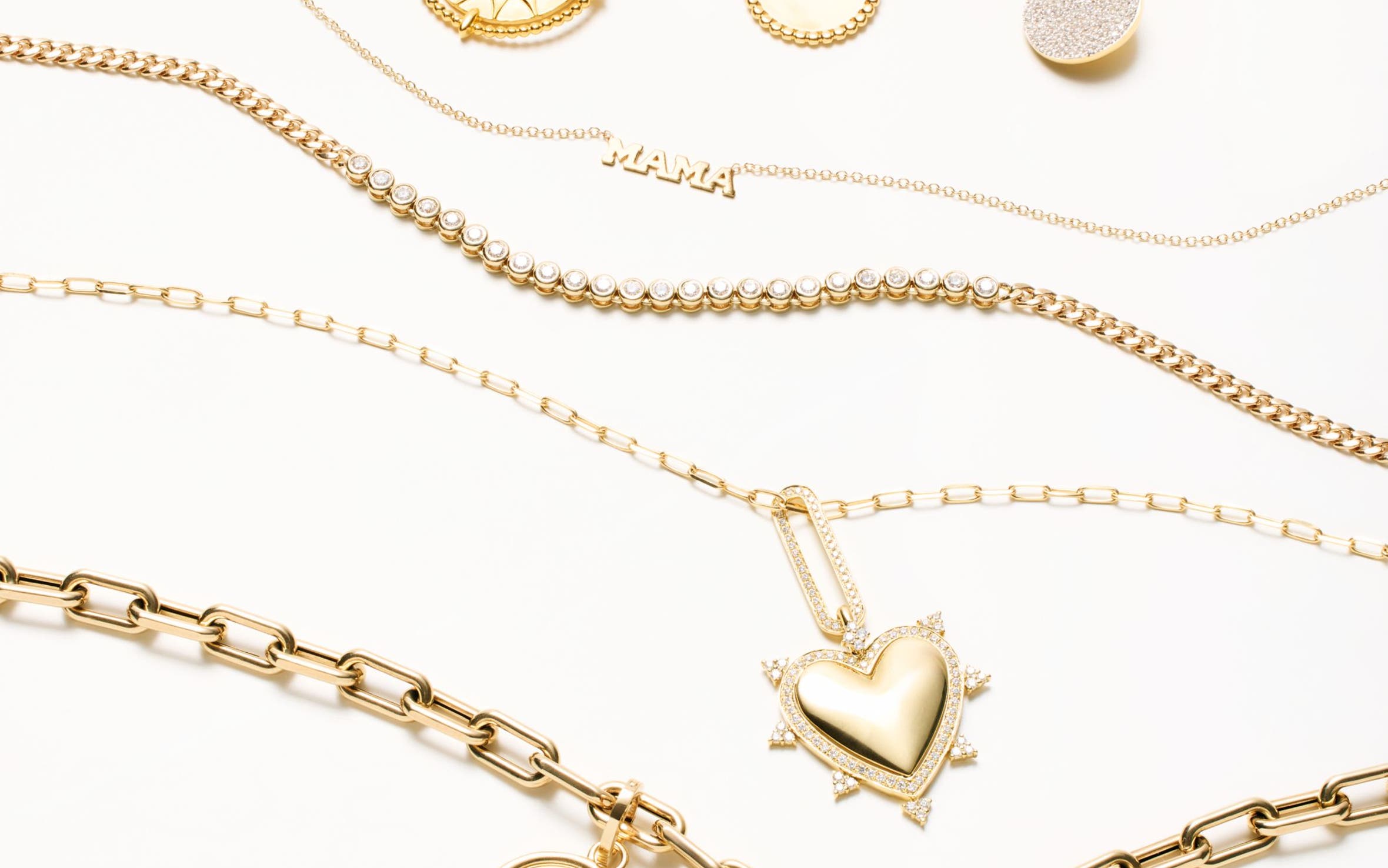 Several gold and diamond necklaces.