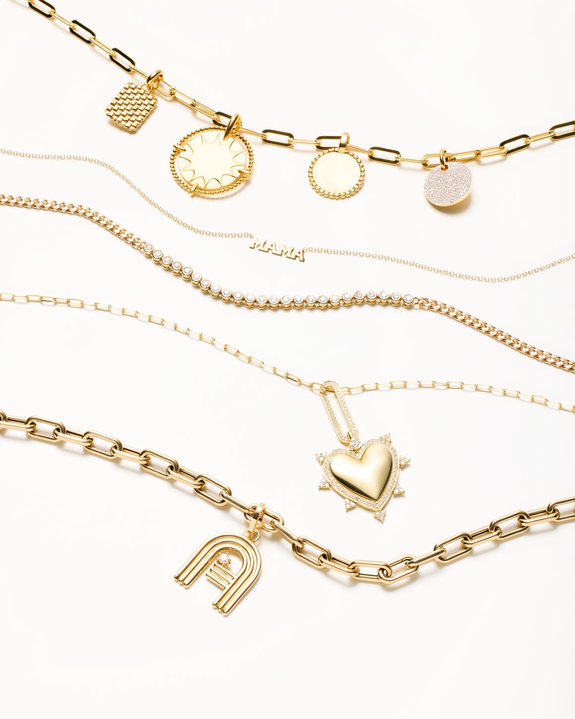 Several gold and diamond necklaces.