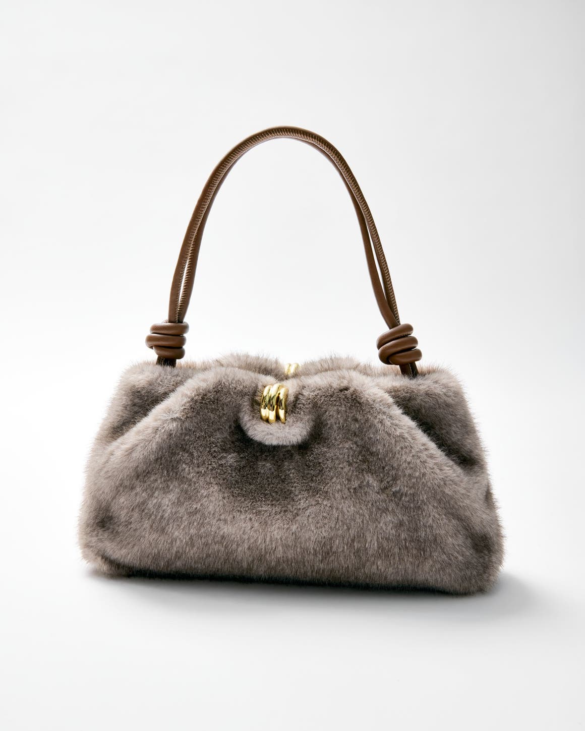 A sell shot of a fuzzy handbag.