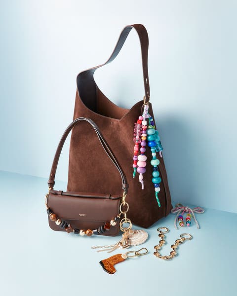 Brown bags with bag charms.