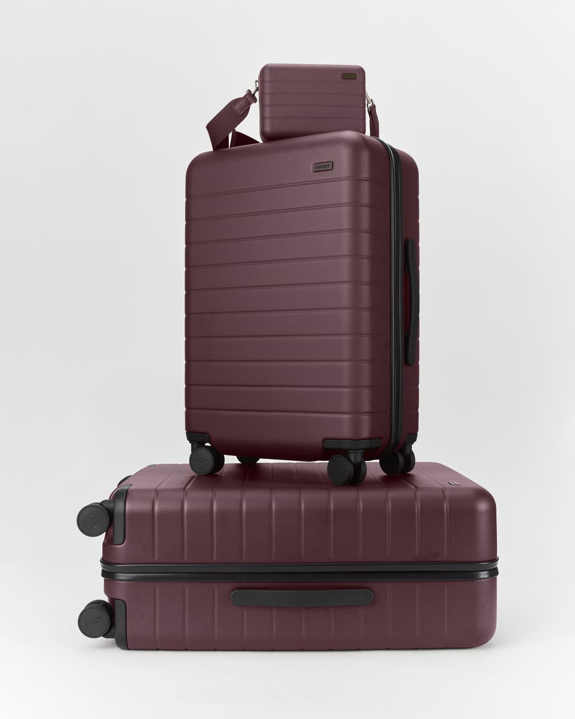Wheeled luggage set in plum.