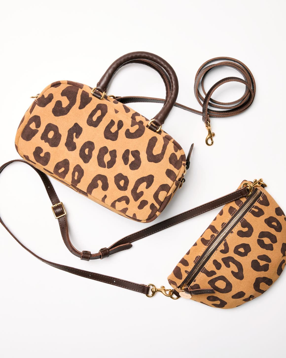 A pair of matching animal-print handbags. 