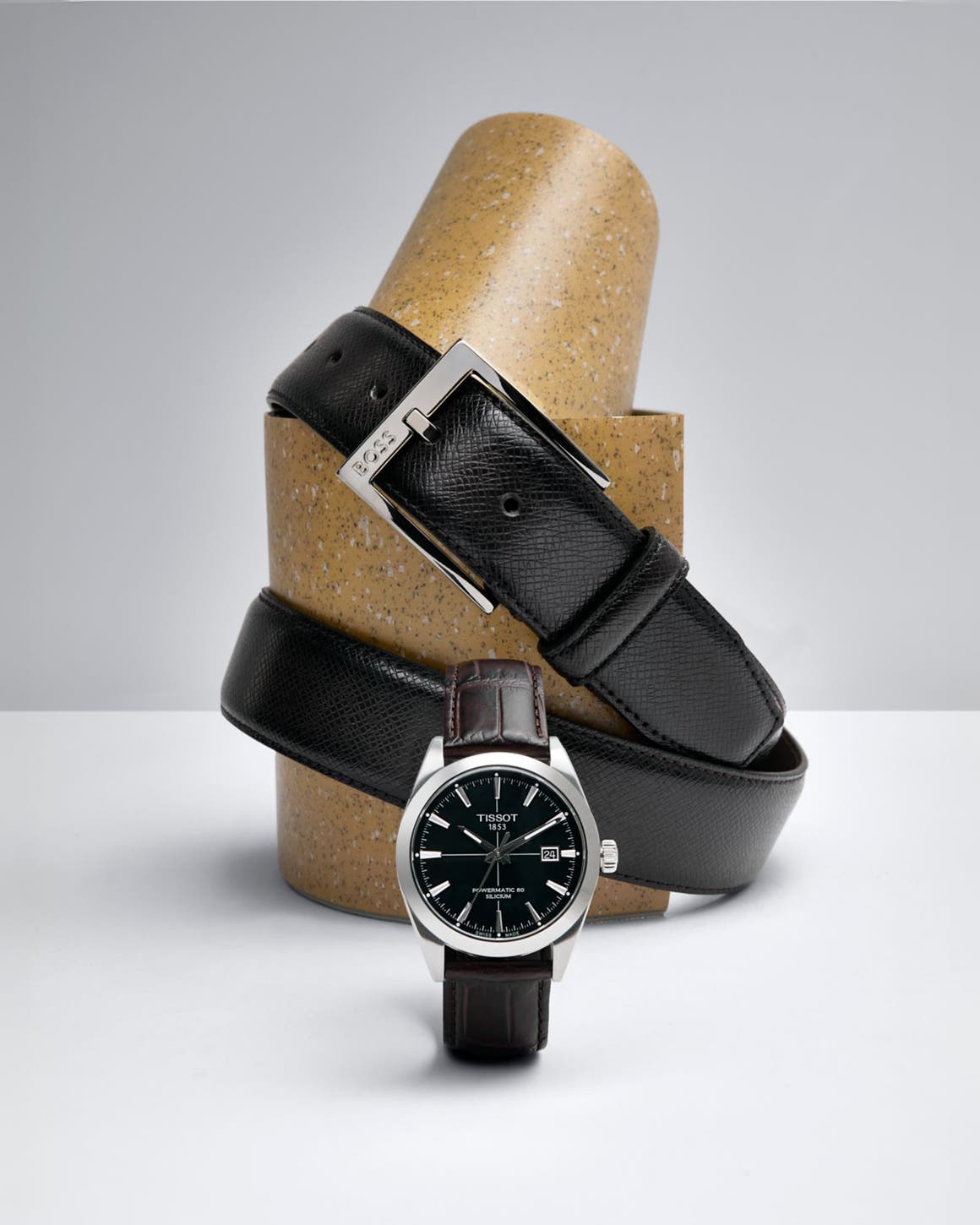 Three watches with black straps.