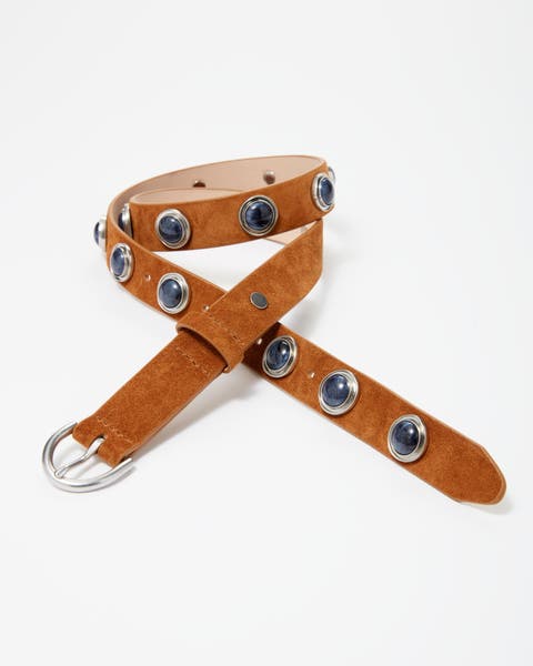 A tan suede belt with embellishments. 
