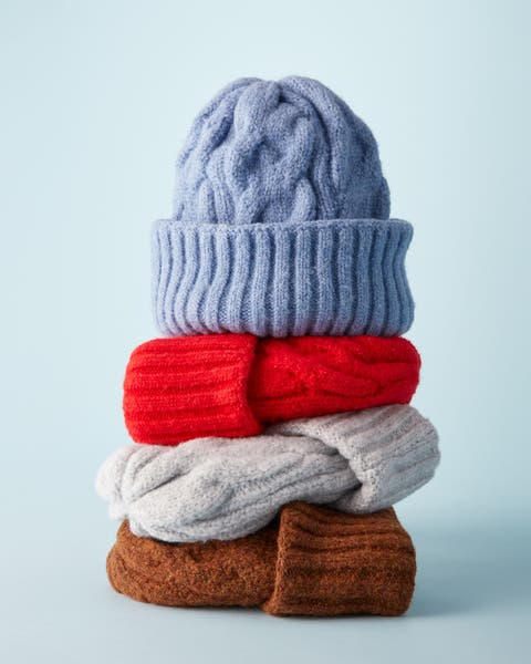Knit hats in blue, red, grey and brown.