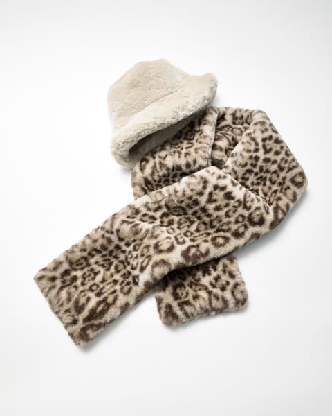 A flat lay of a hat and scarf.