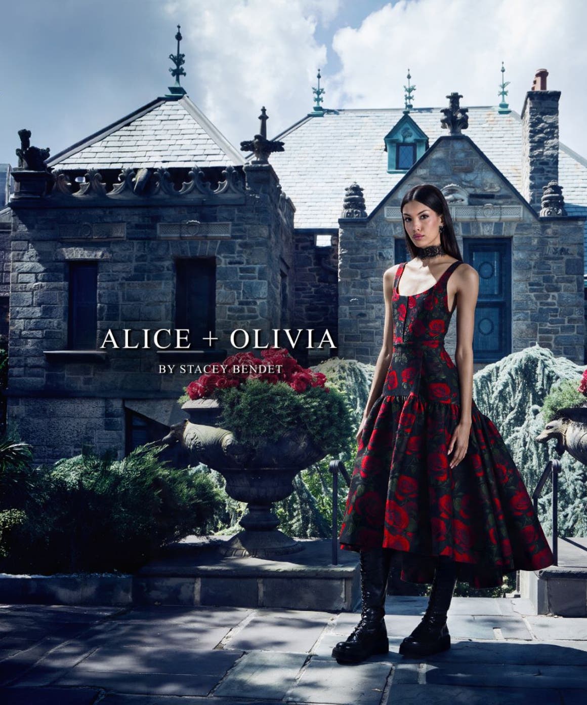 Woman in a black and red floral dress and boots from ALICE + OLIVIA.