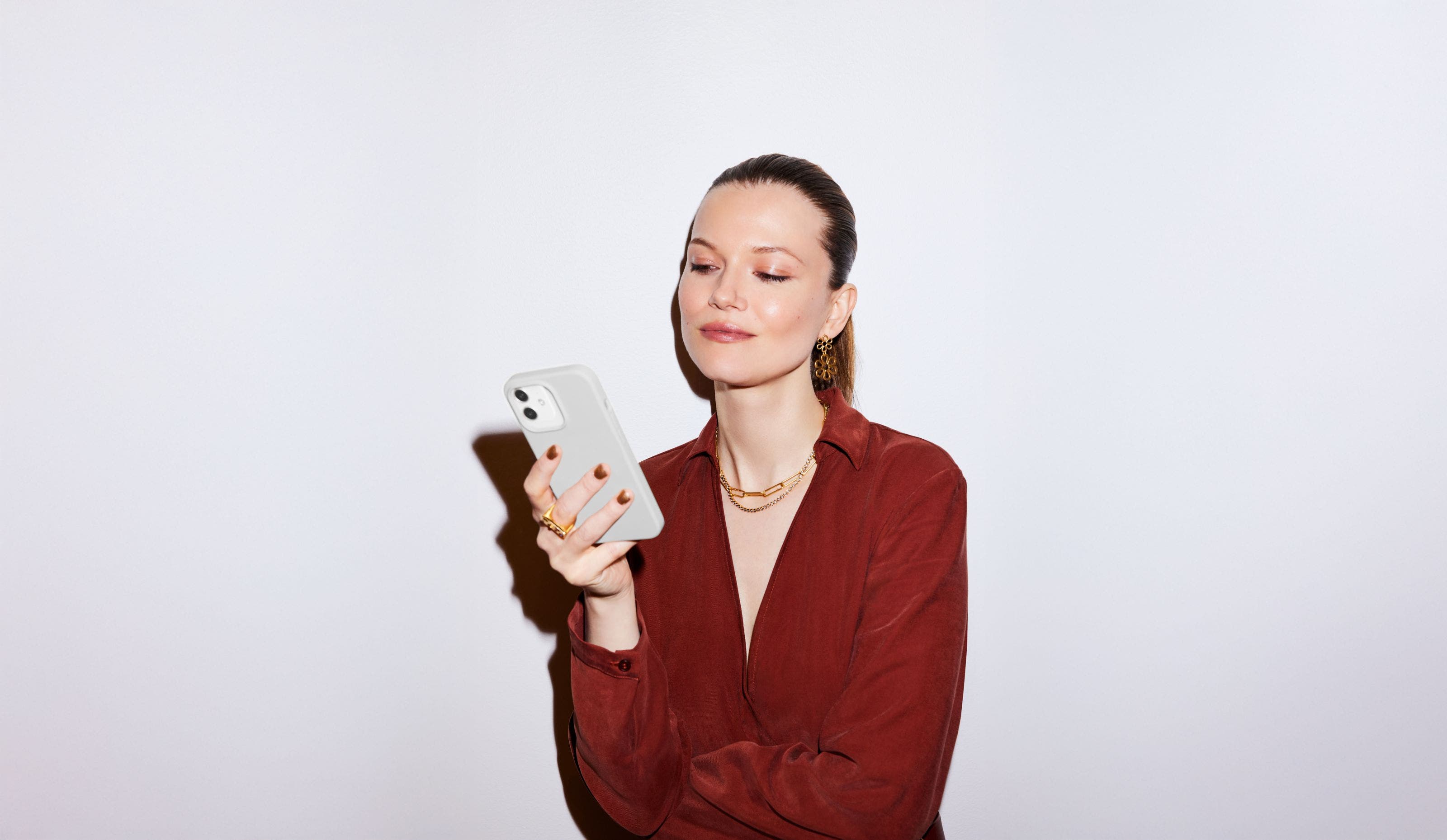 A woman holding a cell phone.