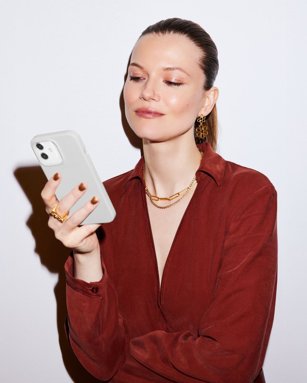 A woman looking at a cell phone.