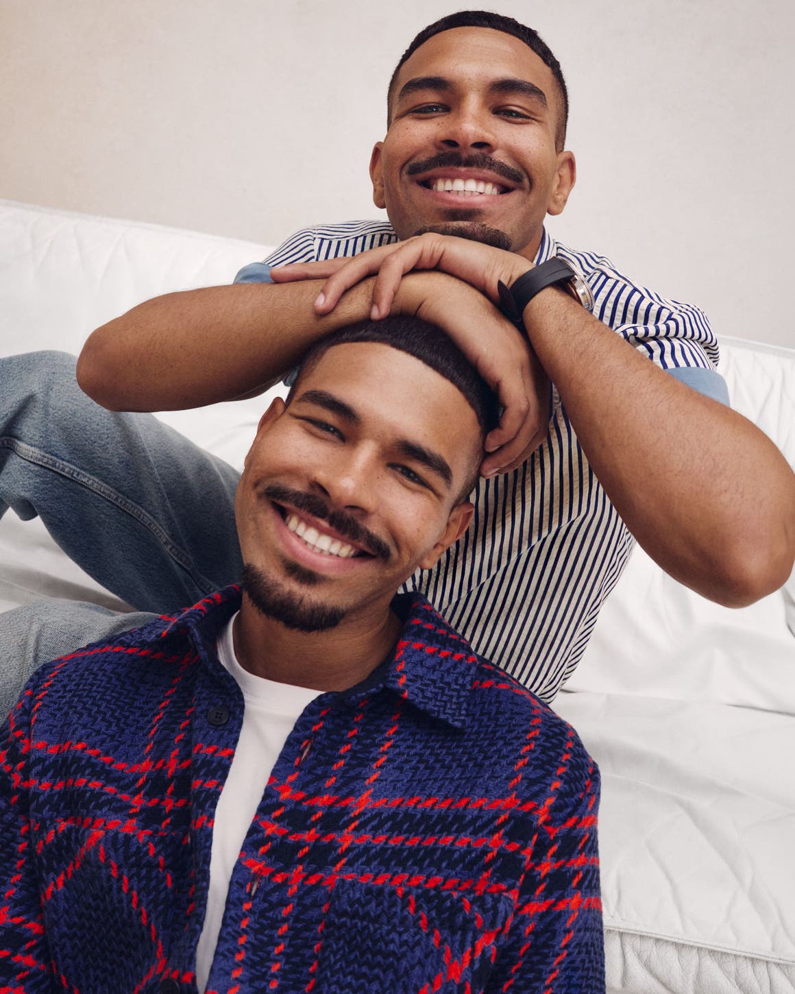Two men wearing Anniversary Sale styles.