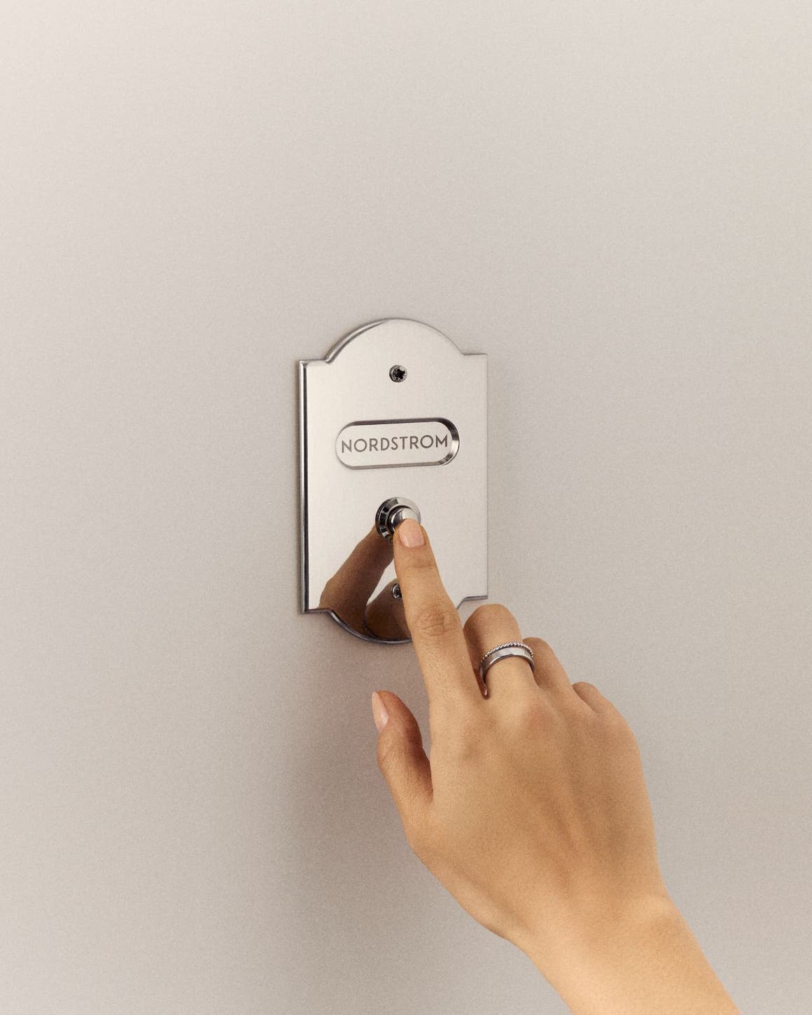 Ringing a Nordstrom doorbell.