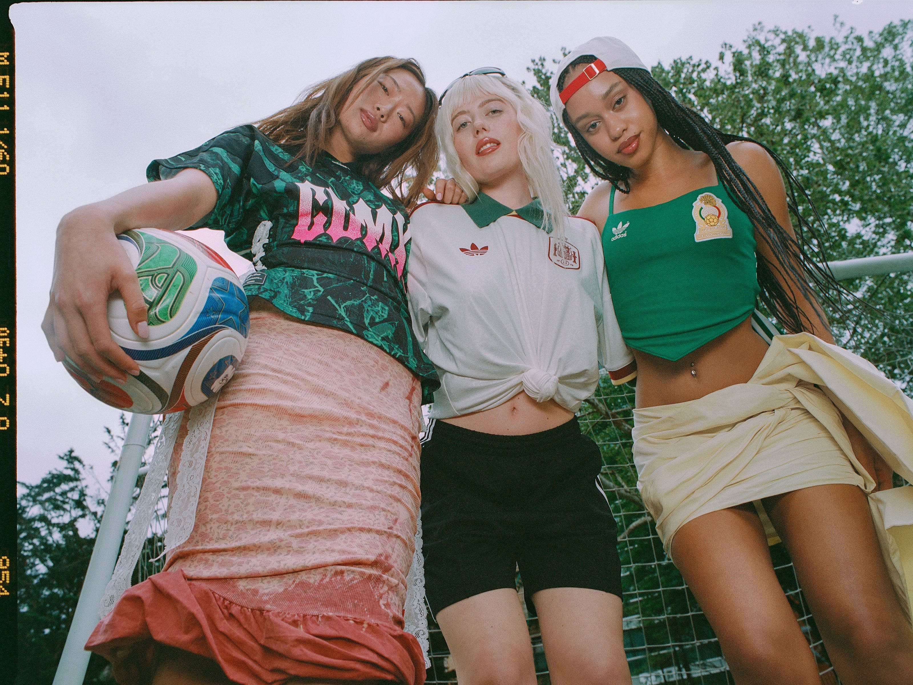 Three women in clothing and gear from the adidas and FIFA World Cup 2026 partnership.