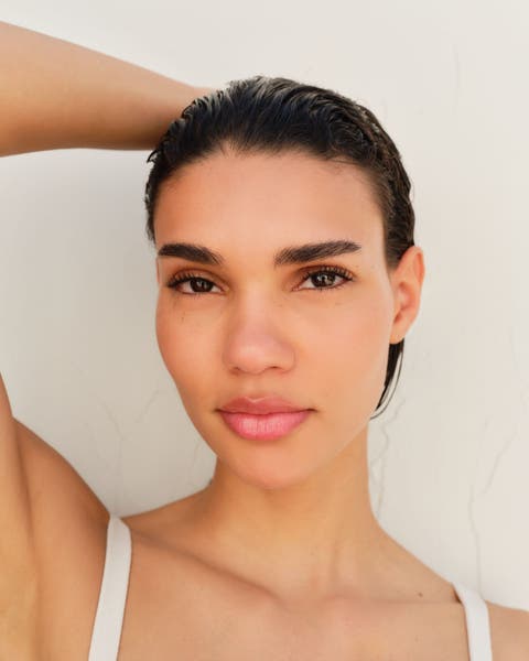 A woman with bold eyebrows.