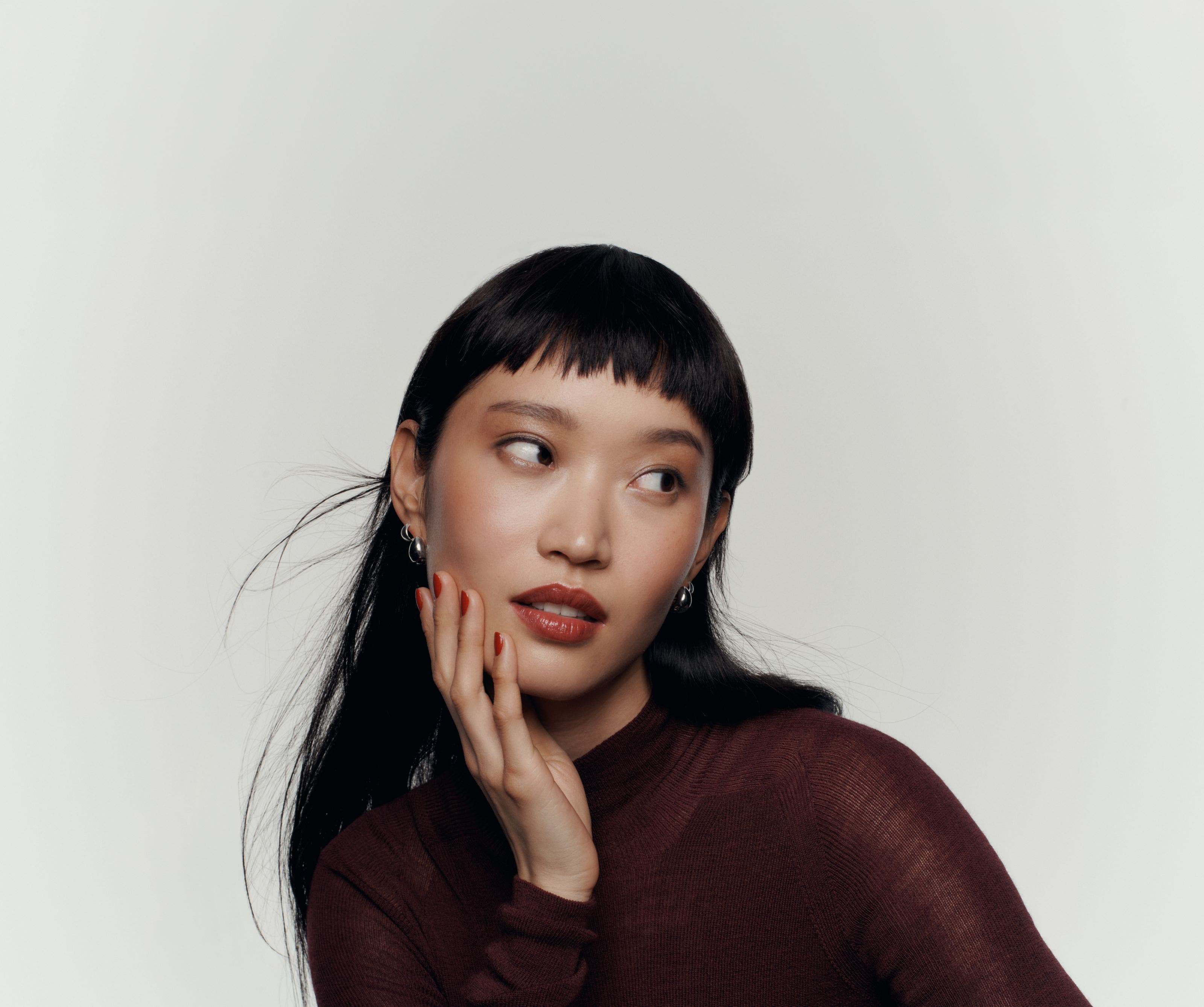 A woman wearing designer makeup.