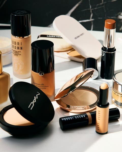 An assortment of makeup products on a counter.
