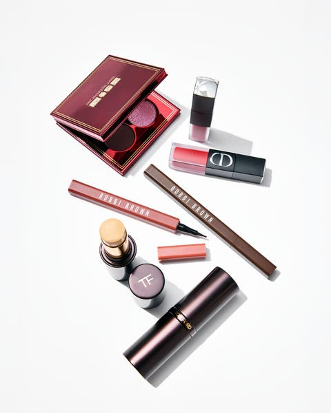 A flat lay of makeup on a white background.