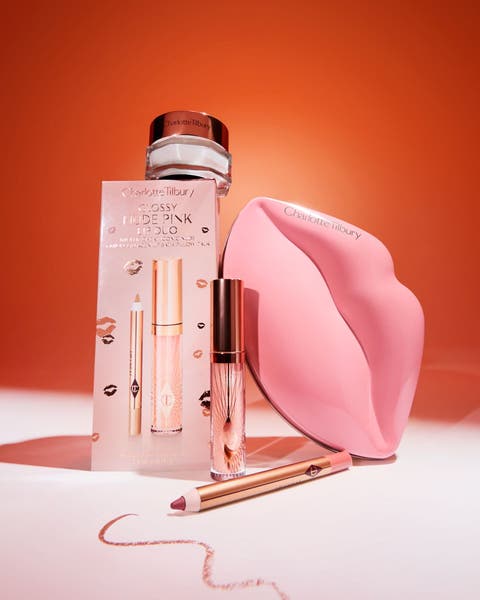 Glossy Nude Lip Duo with lip liner, gloss, and lip-shaped case.