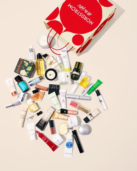 Beauty samples falling out of a shopping bag.