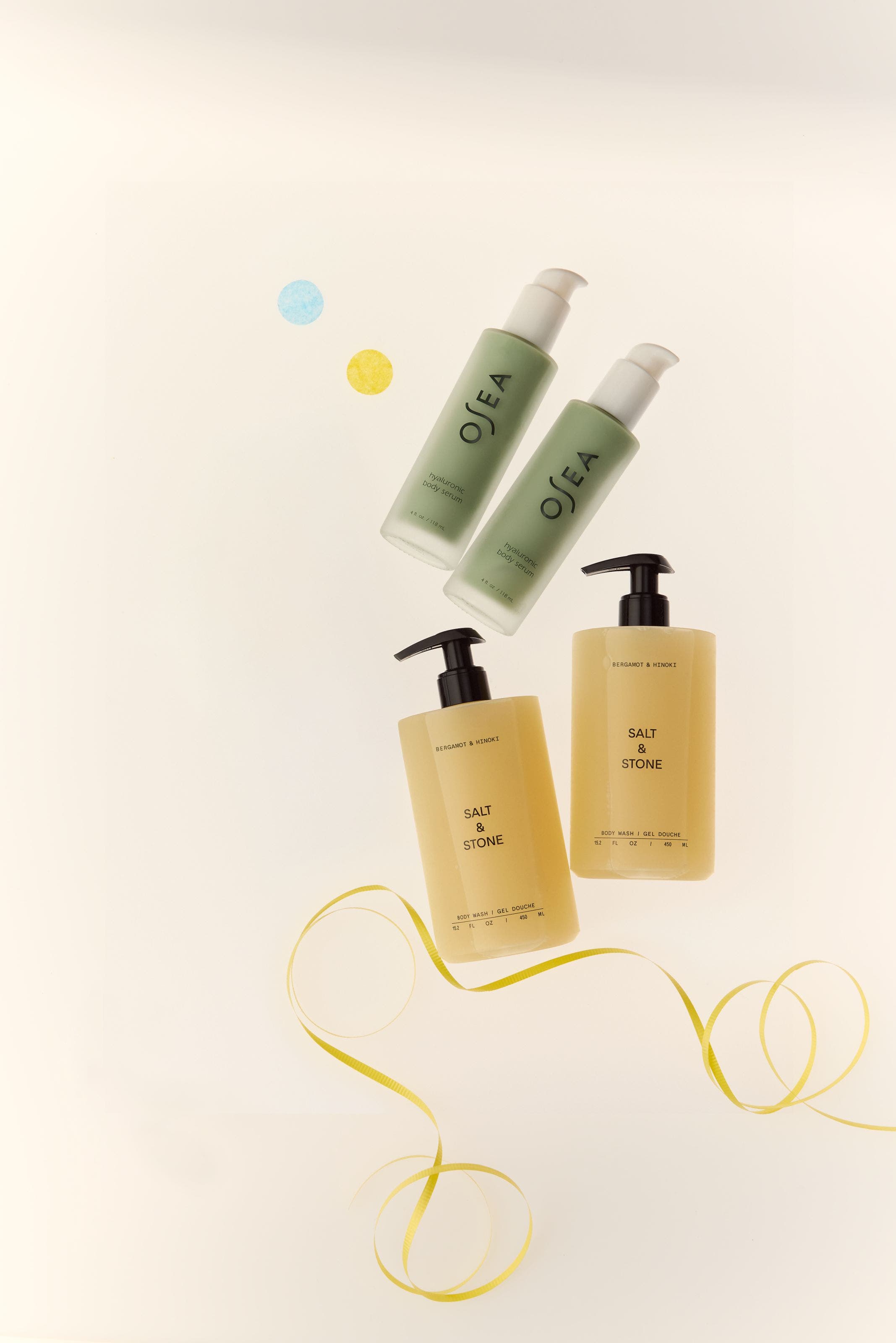 Two bottles of OSEA body serum.