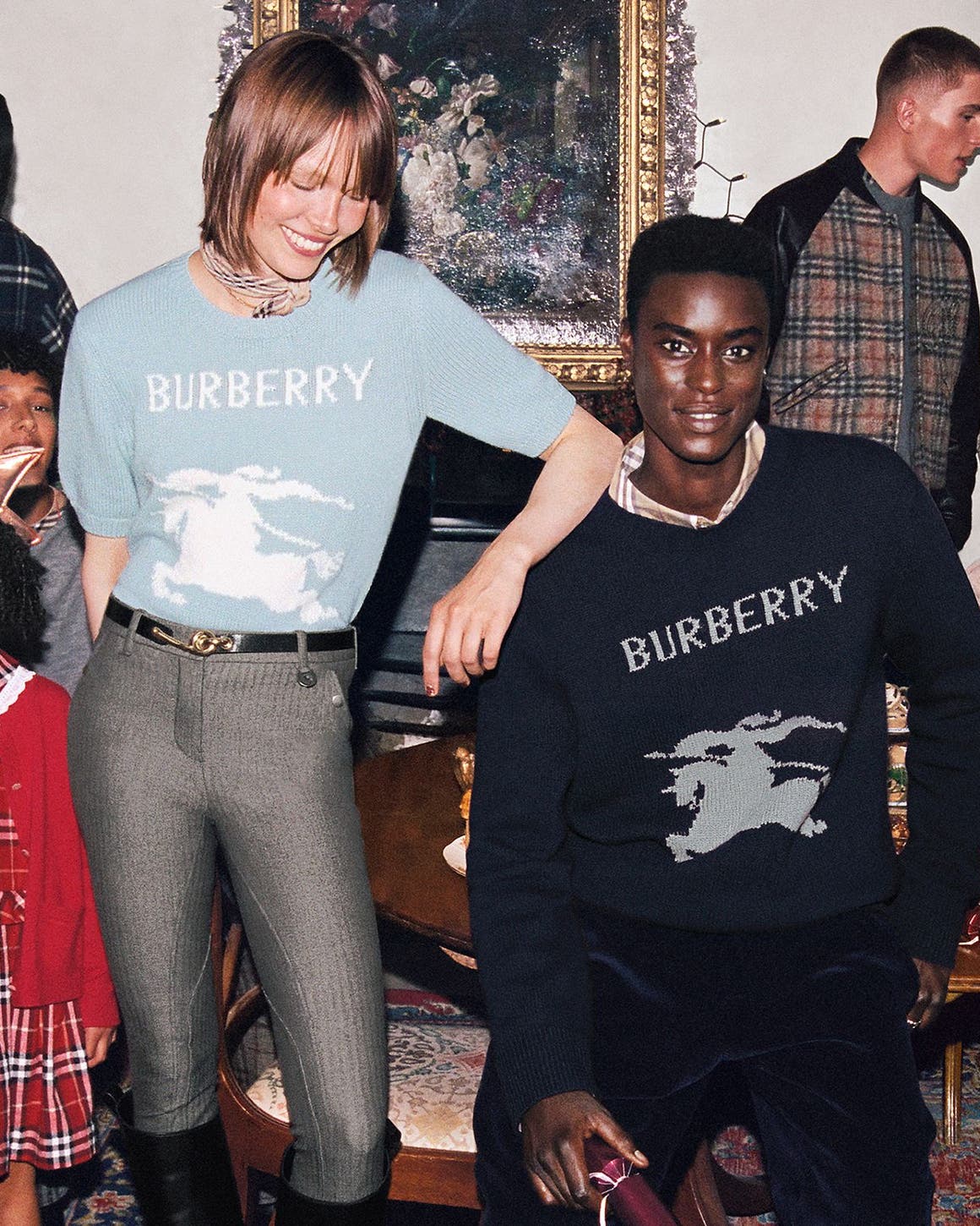 A group of people wearing Burberry.