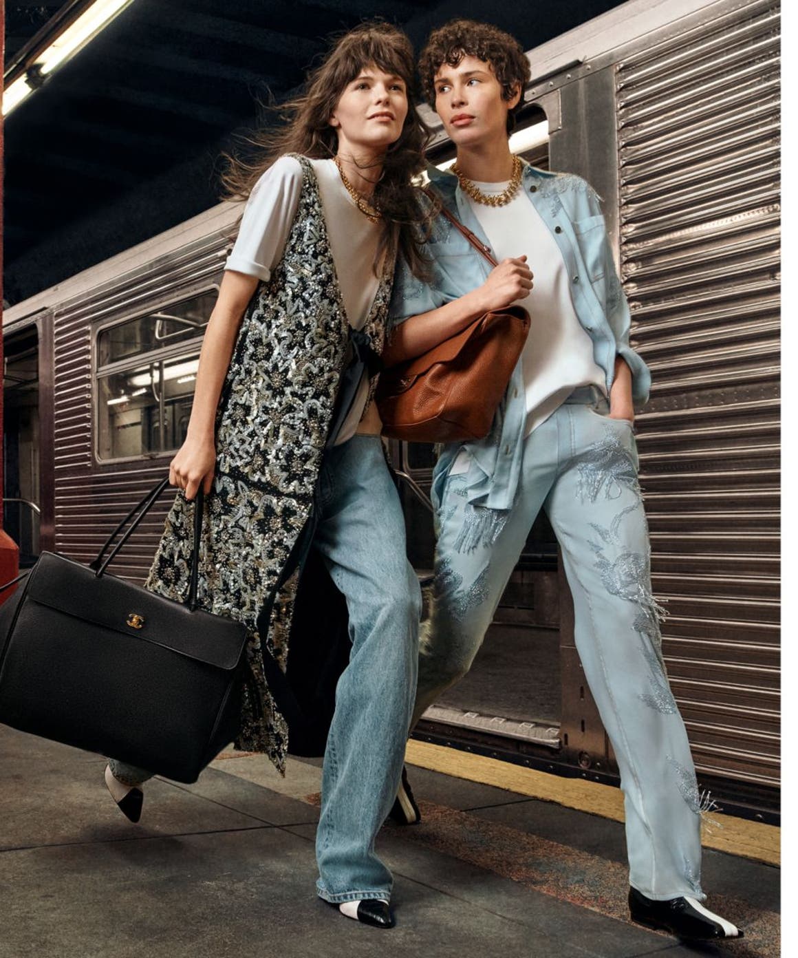two women at train station wearing CHANEL